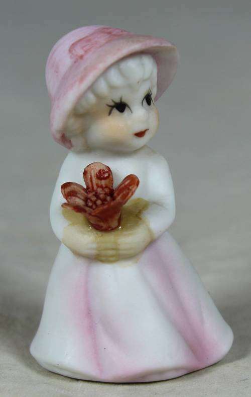 Miniature girl with flower