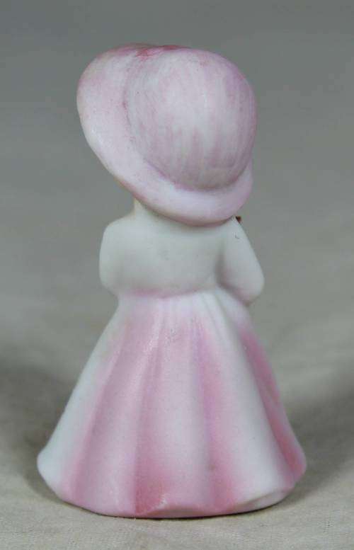 Miniature girl with flower