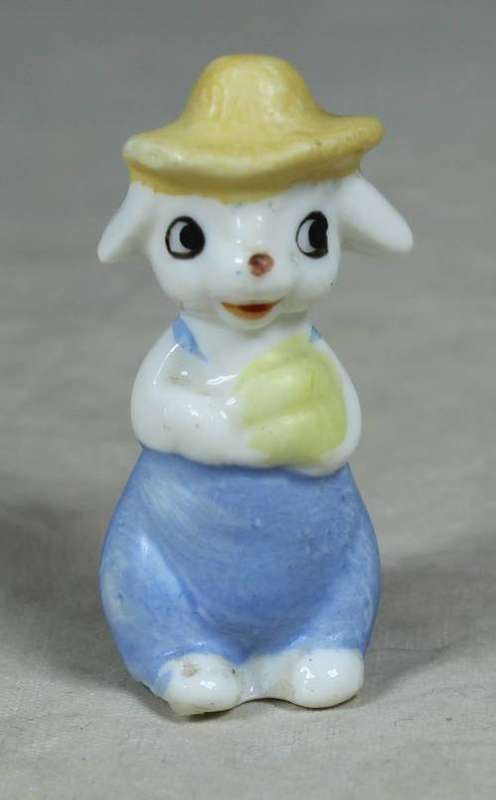 Miniature sheep with a yellow hat