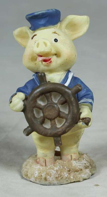 Miniature sailor with a ships wheel