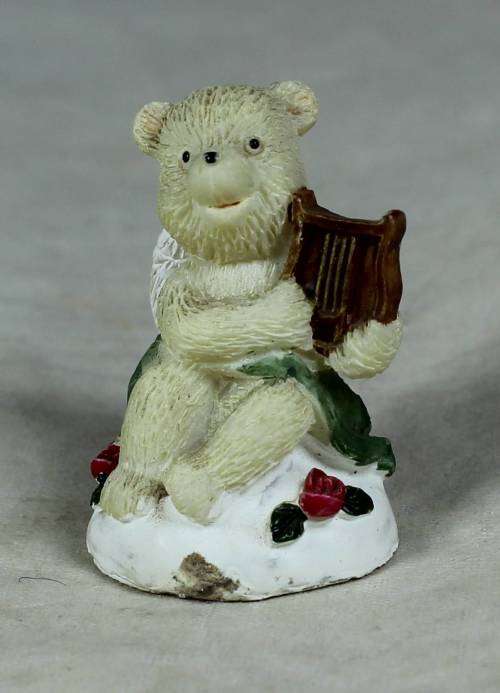 Miniature angel bear playing a harp