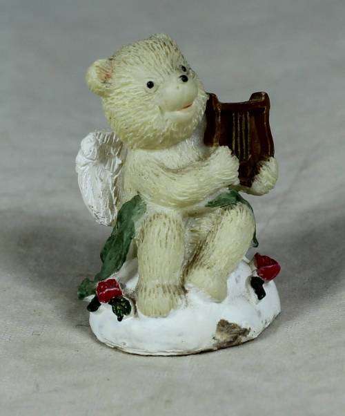 Miniature angel bear playing a harp