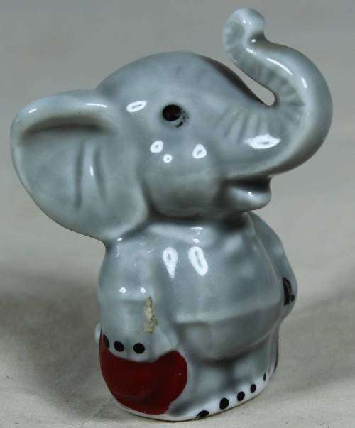 Miniature elephant standing to attention