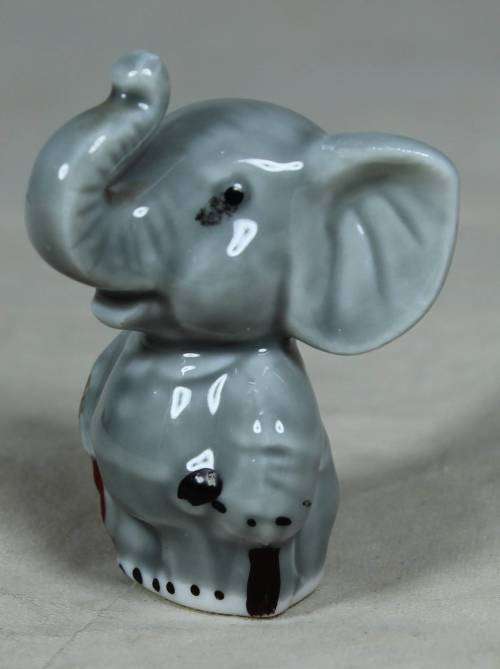 Miniature elephant standing to attention