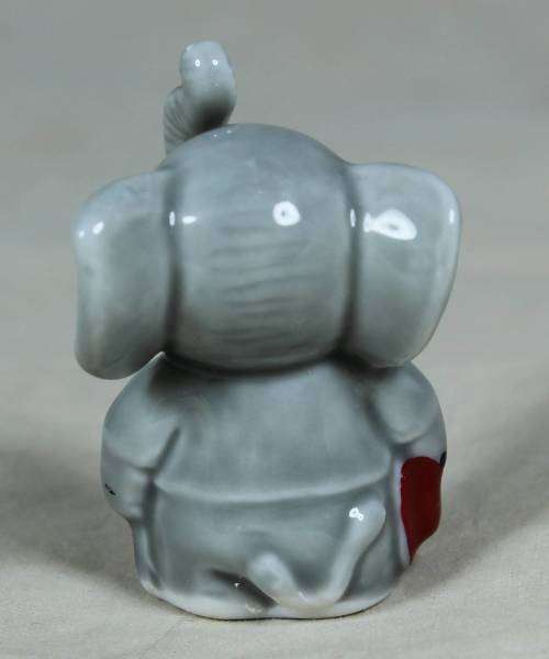 Miniature elephant standing to attention
