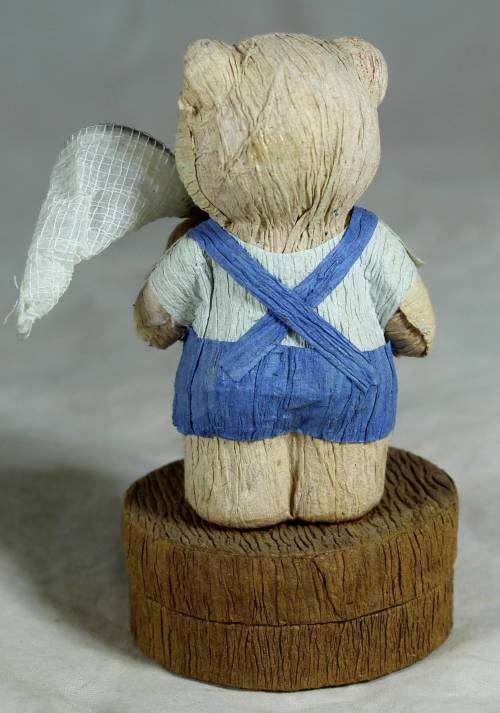 Boy bear with a trinket box underneath holding a net