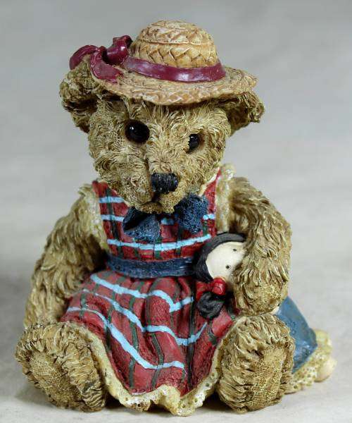 Little bear with a doll