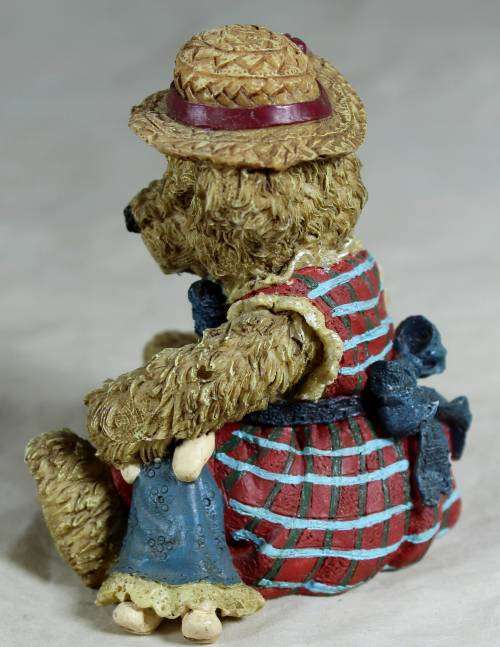 Little bear with a doll