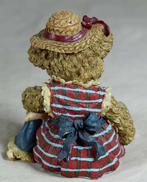 Little bear with a doll