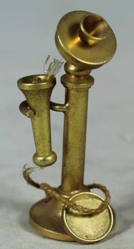 Miniature brass telephone