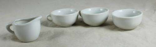 3 Small porcelain cups with a milk jug