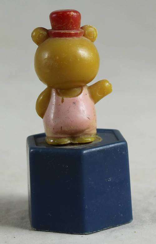 Baby bear on a pedestal
