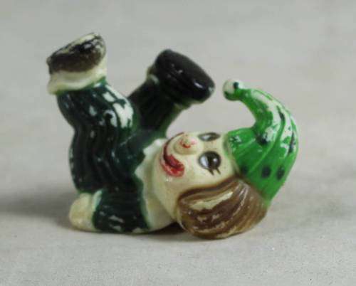 miniature clown with his feet in the air