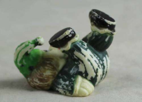 miniature clown with his feet in the air