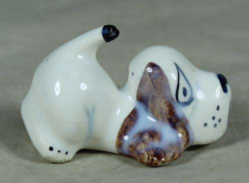 Playful porcelain doggy
