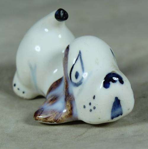 Playful porcelain doggy