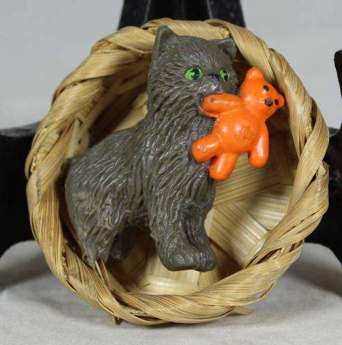 Kitty with a bear in a basket