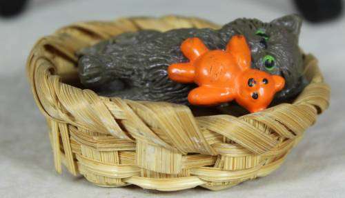 Kitty with a bear in a basket