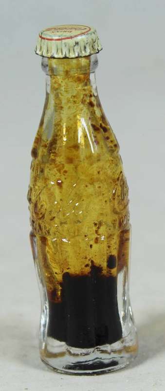 Miniature Coke Bottle - Act fast and bid now!