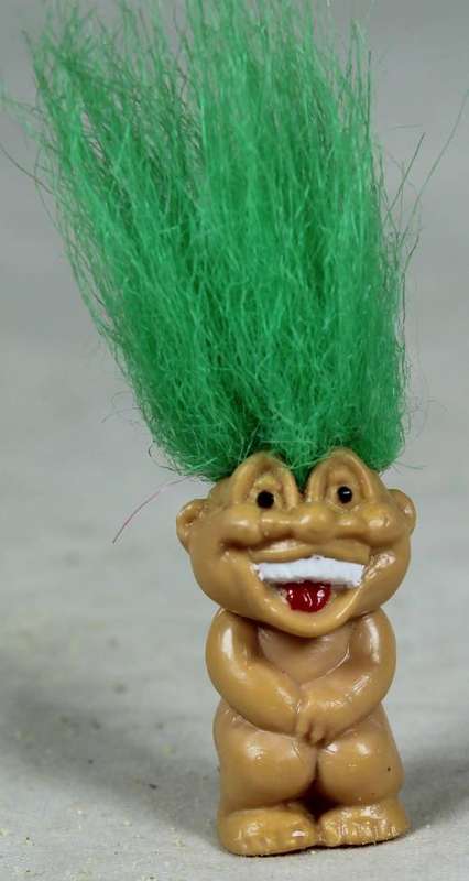 Miniature troll laughing