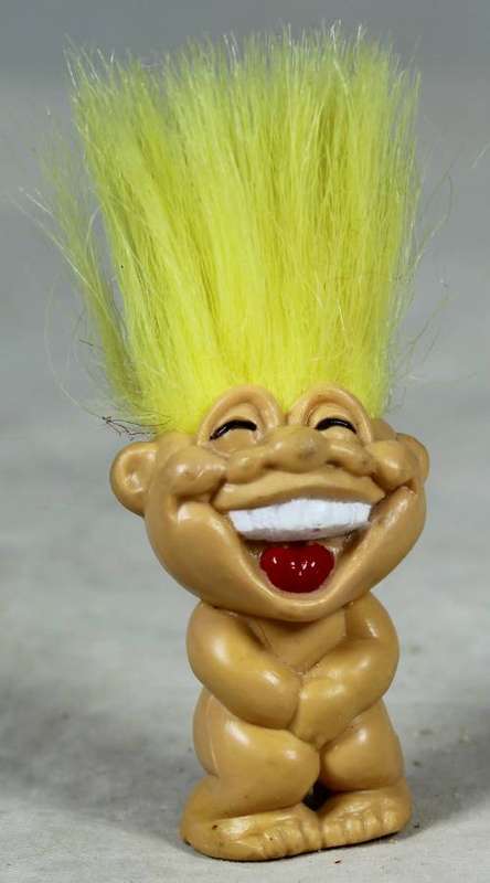 Miniature troll laughing
