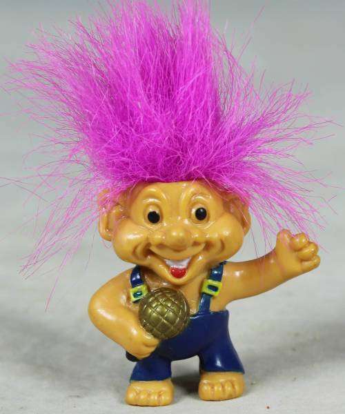 Miniature troll playing a maraca