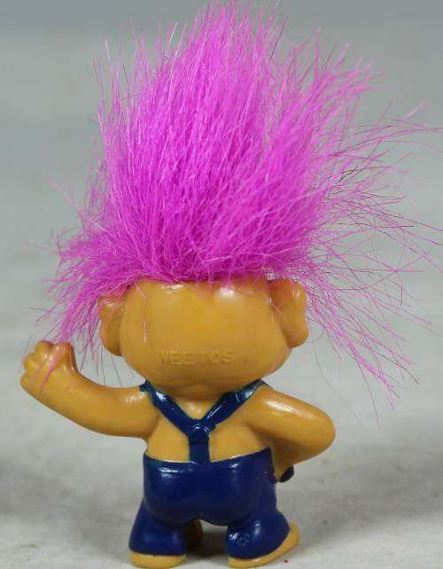 Miniature troll playing a maraca