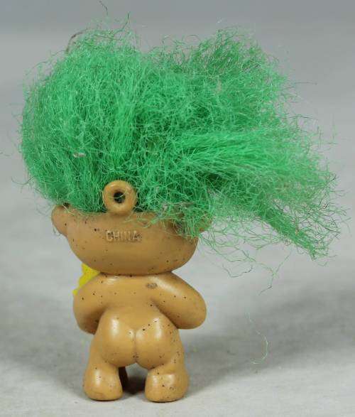 Miniature troll eating a lolly