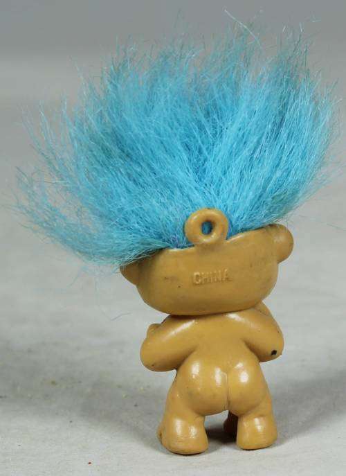 Miniature troll holding a heart