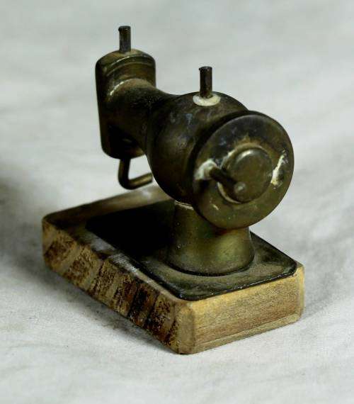 Miniature brass sewing machine