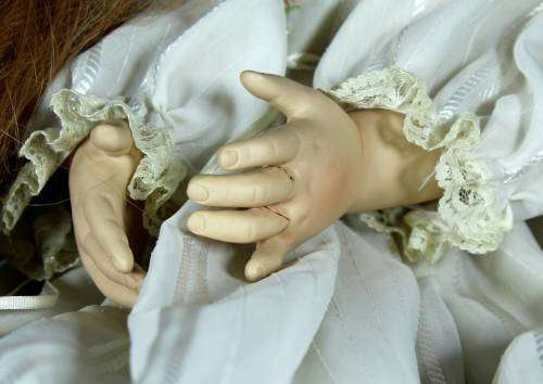Porcelain doll - Bell Ceramics - Ursula Walters doll - sitting