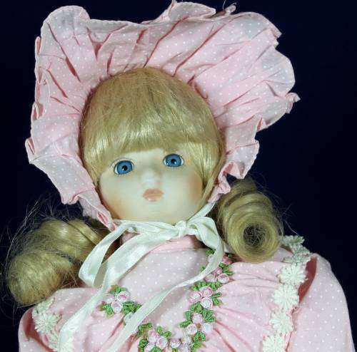 Porcelain doll - girl in pink dress