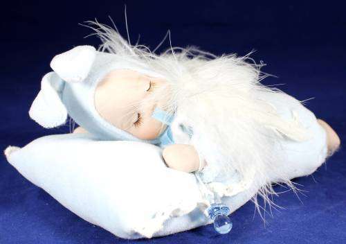 Porcelain doll - baby sleeping on pillow with music box