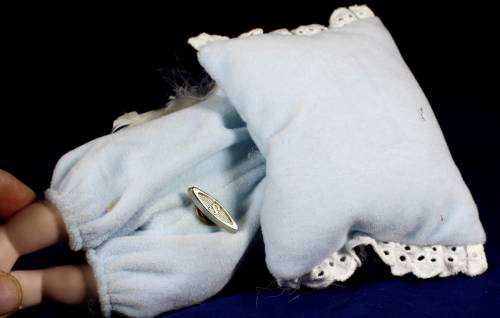 Porcelain doll - baby sleeping on pillow with music box