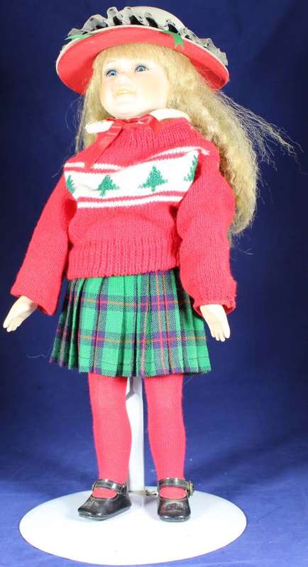 Porcelain doll schoolgirl on stand