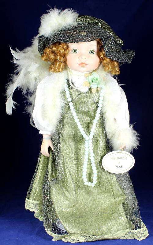Porcelain doll  Alice in grown up clothes on stand