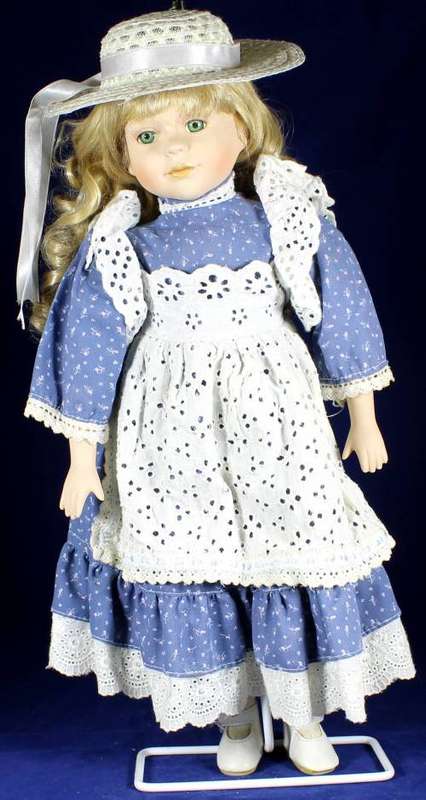 Porcelain doll - country girl on stand