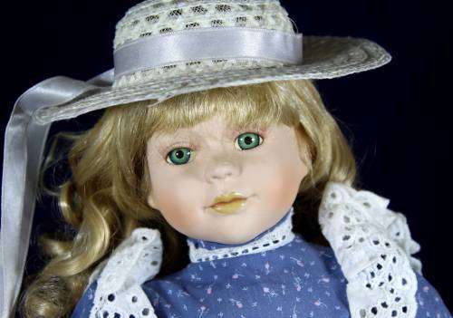 Porcelain doll - country girl on stand