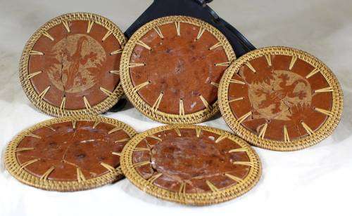 Set of five pottery and braided coasters