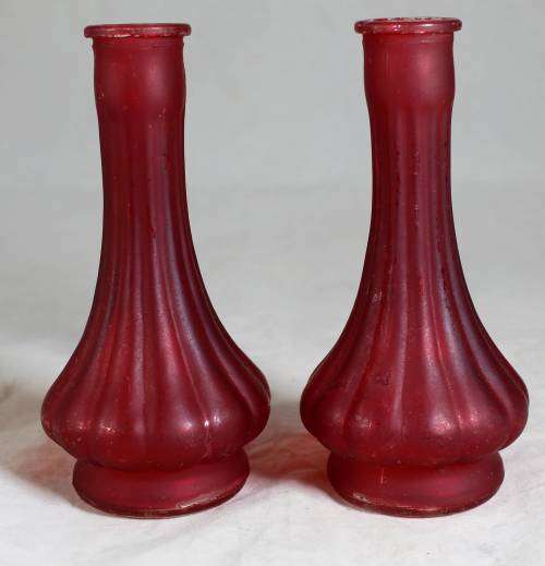 Pair of small red ornate vases