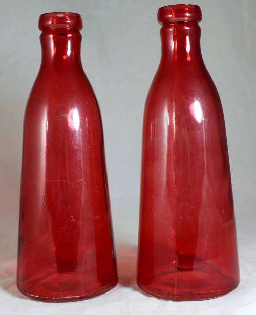 Pair of large red bottles