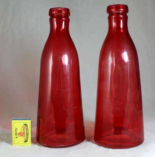 Pair of large red bottles