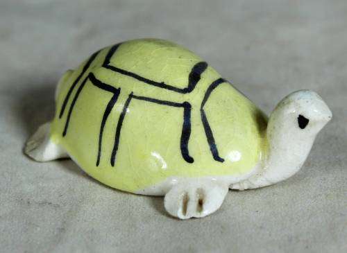 Miniature yellow tortoise