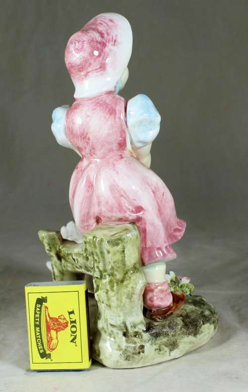 Little girl feeding the ducks figurine