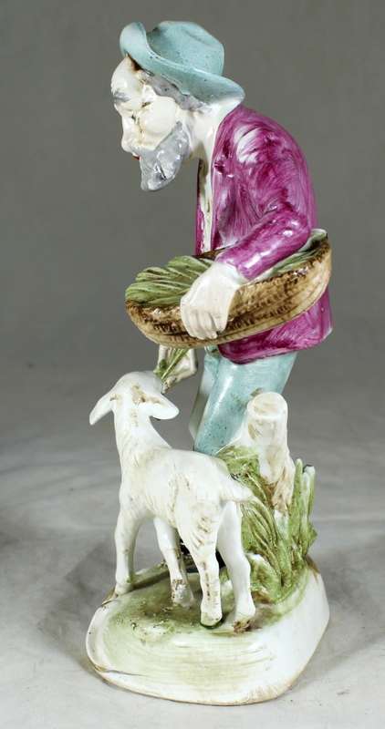 Old Man Feeding a Sheep Figurine