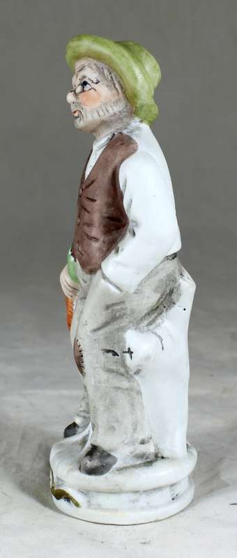 Old Man Holding Carrots Figurine