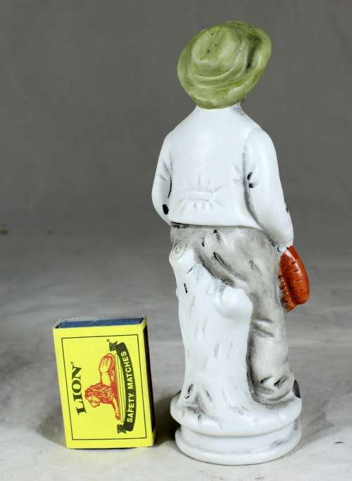 Old Man Holding Carrots Figurine