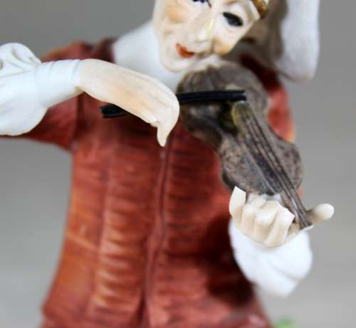 Musician Playing a Violin Figurine  Bid Now!!