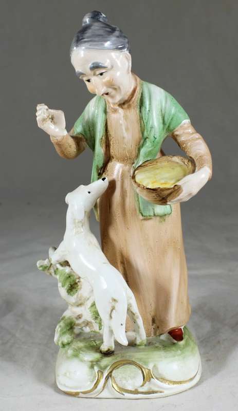 Old Woman with Dog Figurine  Bid Now!!