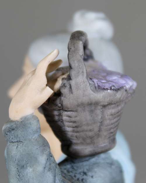 Old Woman with Basket Figurine  Bid Now!!
